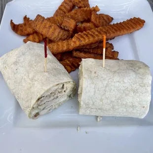 Chicken Cesar salad wrap with sweet potato fries