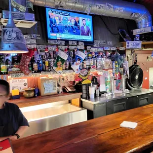 a woman sitting at a bar