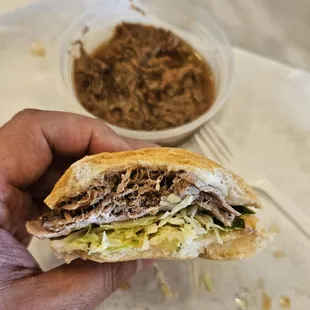 The Famous Ferdi Special po boy with side of debris au jus.