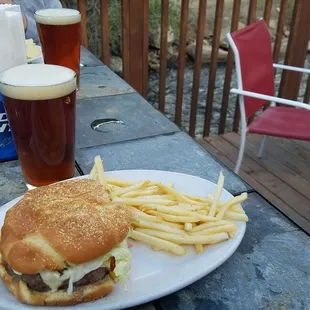 a burger and fries on a plate