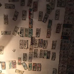 $1 bills stapled all over the ceiling.