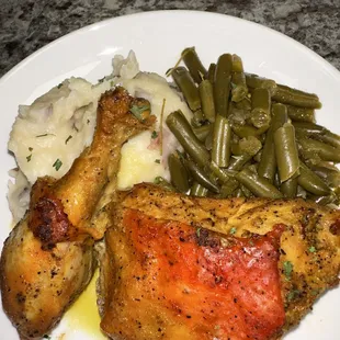 Baked chicken, garlic, mashed potatoes and sautéed string beans