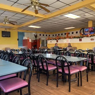 a restaurant with tables and chairs