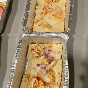 three pans of food on a table