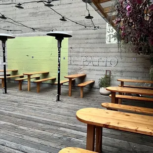 tables and benches on a wooden deck