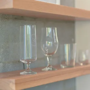 empty wine glasses on a shelf