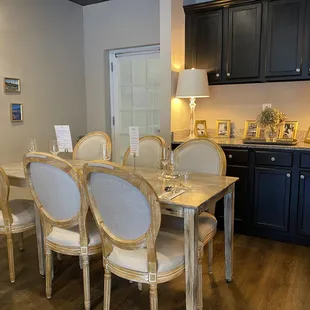 a dinning room with a table and chairs