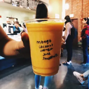 a person holding a cup of coffee