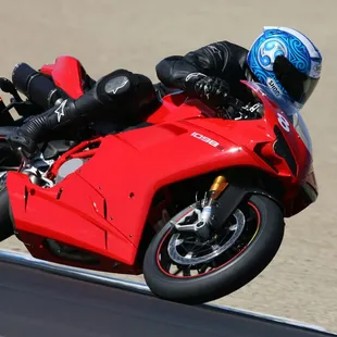 Steve shredding asphalt at Laguna Seca