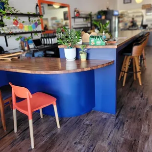 a view of a counter and chairs