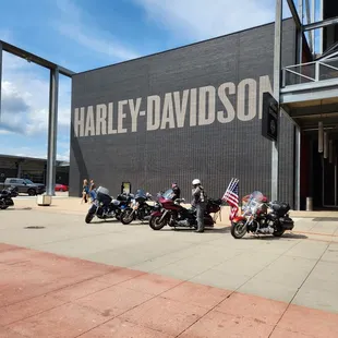 motorcycles parked in front of a building