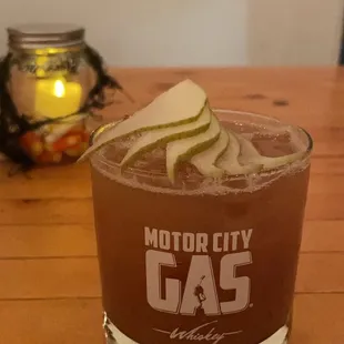 a drink in a glass on a table