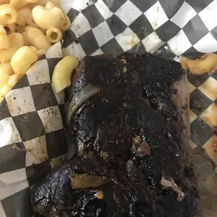 a piece of meat and macaroni and cheese