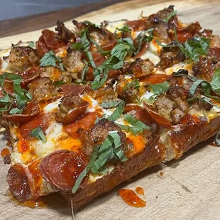 Gold Rush - garlic white sauce, pinched Italian sausage, pepperoni, hot honey
