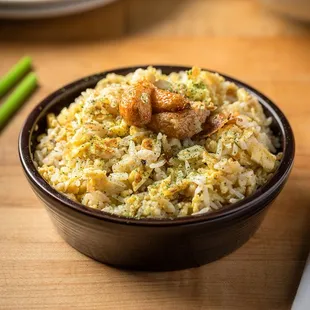 a bowl of fried rice on a table