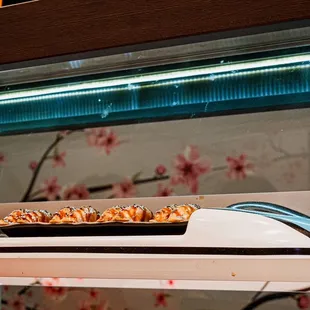 a sushi dish on a counter