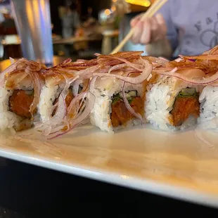a close up of a sushi roll on a plate