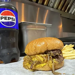 Motz's Burgers double cheeseburger slider with French fries and a Pepsi