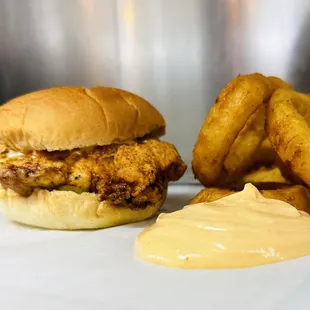 Motz&apos;s Burgers chicken sandwich and onion rings with spicy mayo dipping sauce.