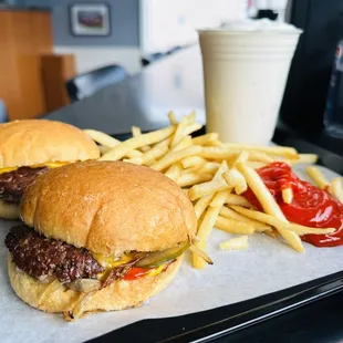Motz&apos;s fresh beef cheeseburger sliders, shoestring french fries and vanilla milkshake.