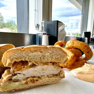 Motz&apos;s Burgers chicken sandwich and onion rings with spicy mayo dipping sauce.