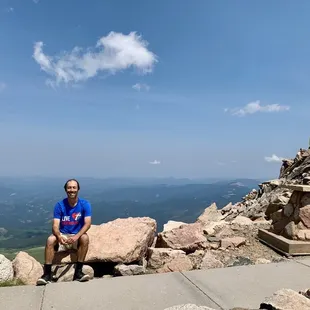 Enjoying a beautiful summer day from high above the summit of Mount Evans.