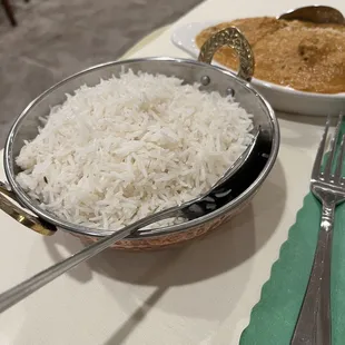 a bowl of rice and a bowl of curry