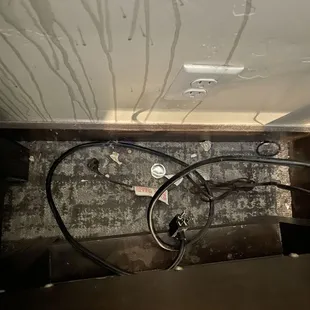 Splash of something and trash behind the end table