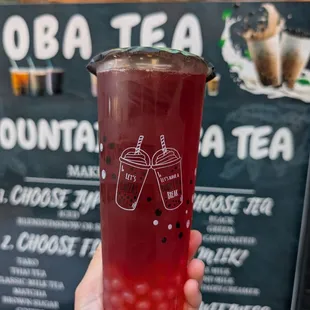 red guava and dragonfruit fruit tea with lychee popping boba