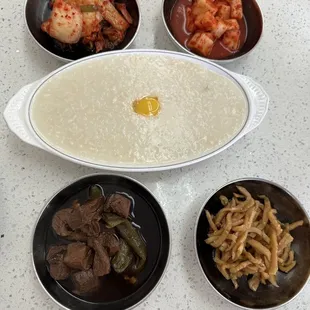 a bowl of porridget, a bowl of noodles, a bowl of meat, and a bowl of noodles