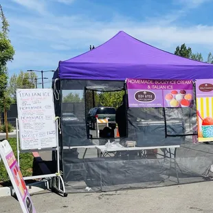 a tent with a purple canopy