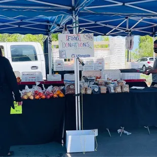 a woman standing under a tent