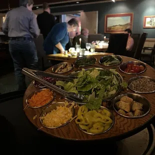 The salad tossed table side with all kinds of add in choices! Really nice as part of your side choice for dinners.