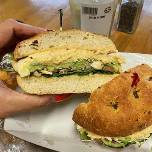 Custom sandwich. Hummus, sprouts, almonds, avocado, tomatoes, greens, vegan focaccia bread
