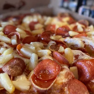Pepperoni and pineapple pizza