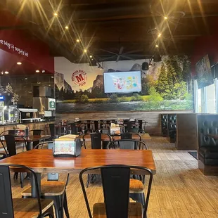 Dining room, TV's and Yosemite pictures on the walls