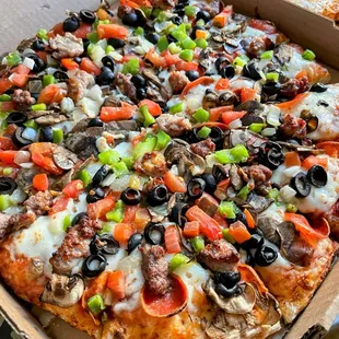 McKinley: Red Sauce, Cheese, Pepperoni, Mushrooms, Black Olives, Green Bell Pepper, Onion, Diced Tomatoes, Beef, Italian Sausage.