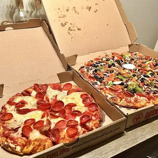 Small pepperoni pizza. Large "The McKinley" pizza. Showing side by side to see the size difference.