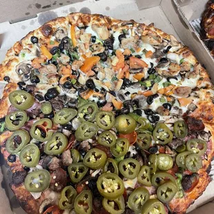 Half The Everest Pizza with jalapeños half robbers roost