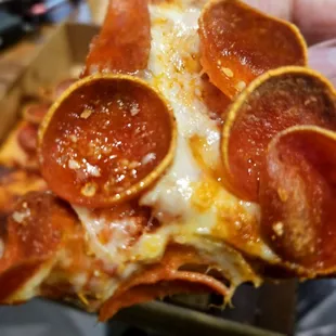 a slice of pepperoni pizza