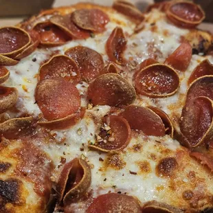a pepperoni pizza in a box