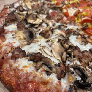 Large pizza, half sausage, mushroom &amp; garlic, the other half cupping pepperoni &amp; pepperoncini