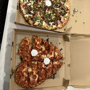two pizzas in boxes