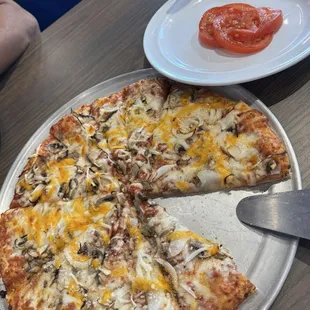 Build your own was ordered with mushroom, onion and sliced tomatoes.