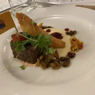 Aged beef, with a delicious cheese sauce with a crostini