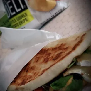 Veggie Panini
 Hummus spread on pita, topped with arugula, tomato, onion, brie cheese and drizzled with Balsamic vinaigrette glaze!