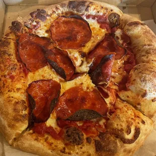 a pepperoni pizza in a box