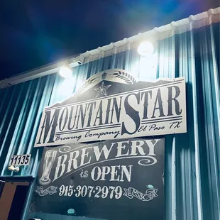 a sign in front of a building