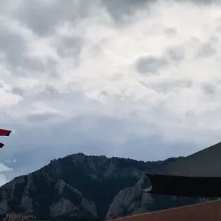 red umbrellas and mountains