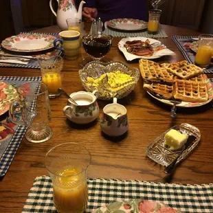 Delicious eggs made with fresh dried rosemary, blueberry waffles, bacon, and orange juice. Very filling